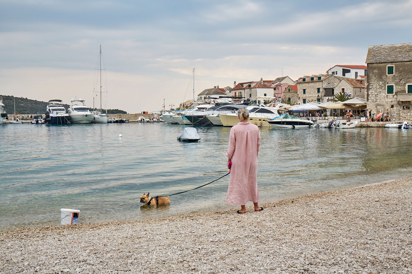woman in pink with her dog
